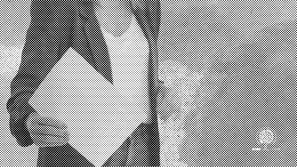 Person holding paper against colorful abstract background.